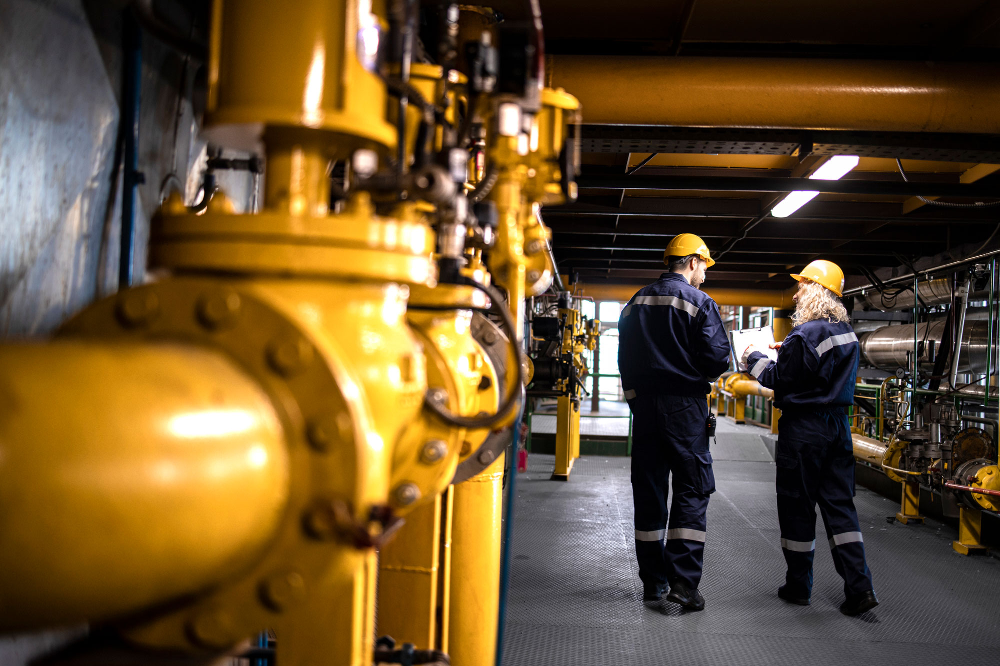Workers walking inside a gas facility