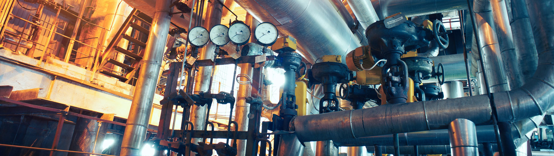 Pressure gauges and pipes inside a factory