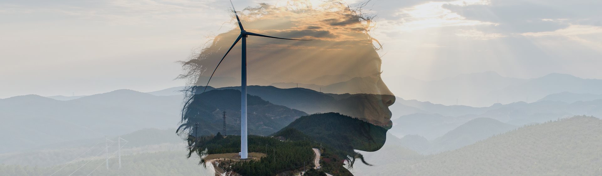 A woman's head superimposed over a hillside with a wind turbine