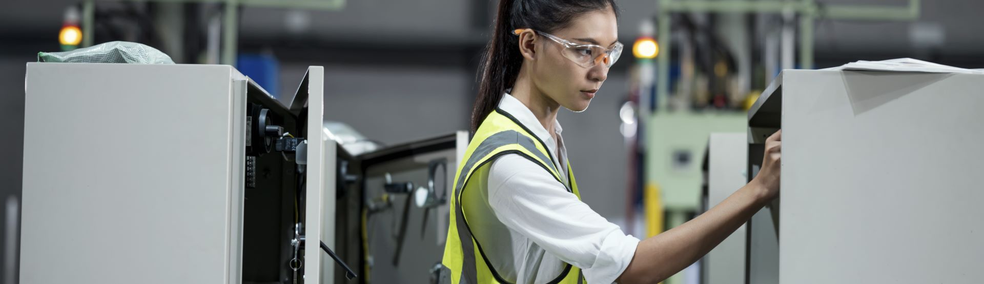 A woman carrying out equipment maintenance