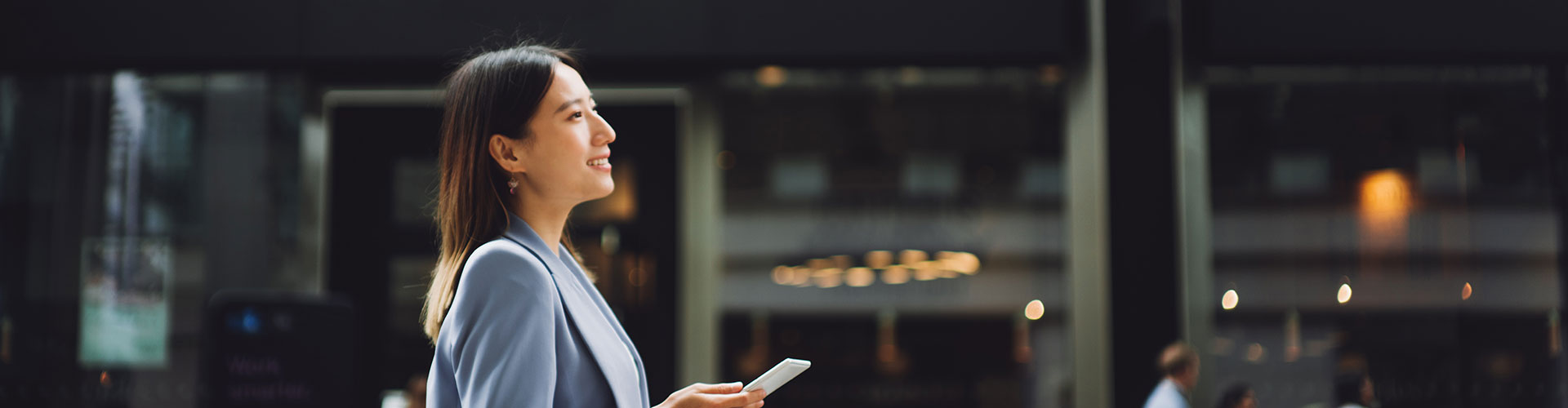 Woman walking with a smartphone