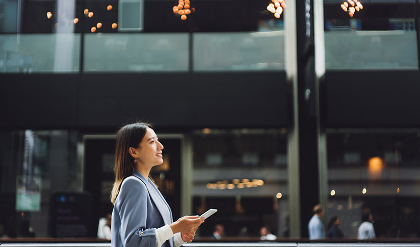 Woman walking with a smartphone