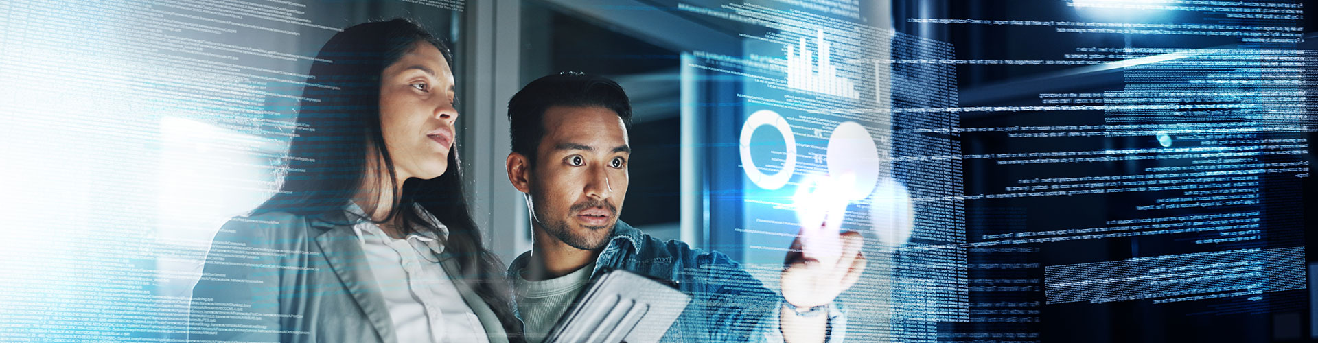 Two colleagues looking at a screen