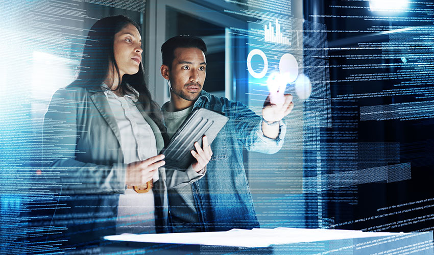 Two colleagues looking at a screen