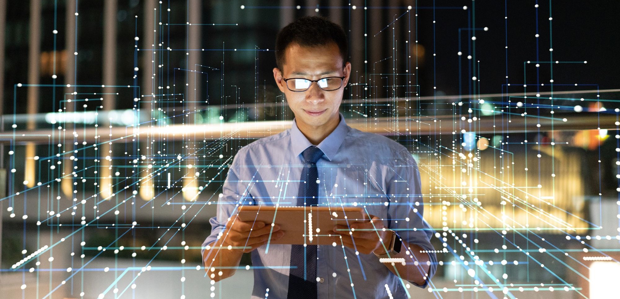 Businessman looking at ipad surrounded by lines representing payments architecture