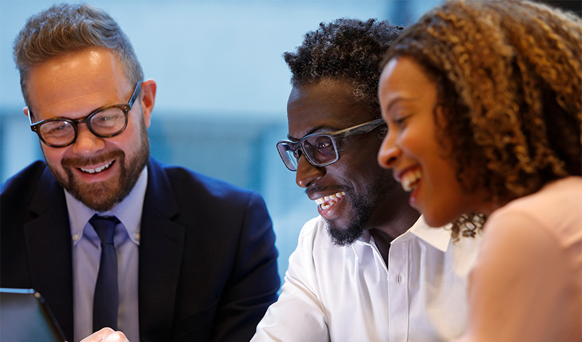 Business people laughing during a meeting
