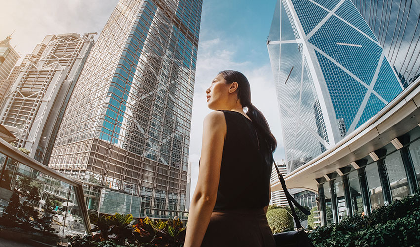 Woman walking in a busy city