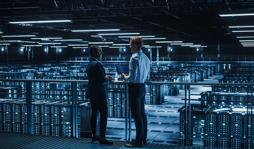 Two people having a conversation in a data centre