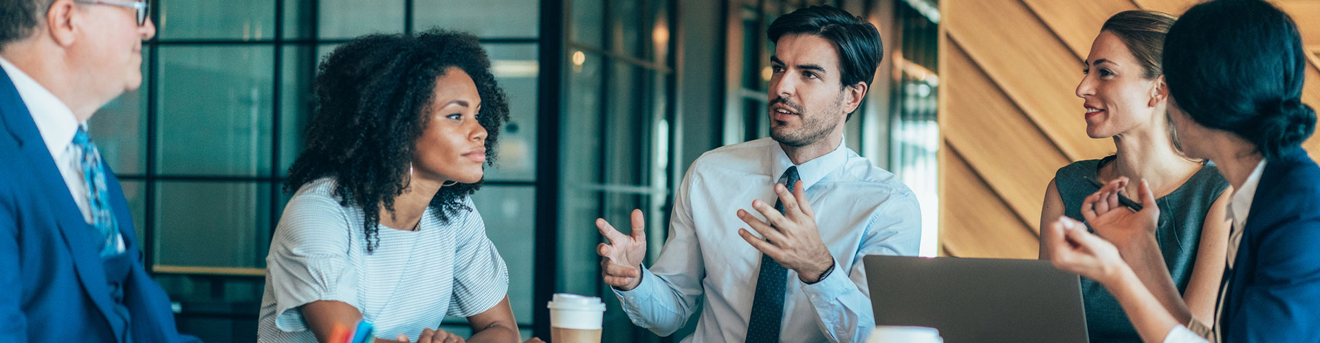 Group of business people talking around the conference table
