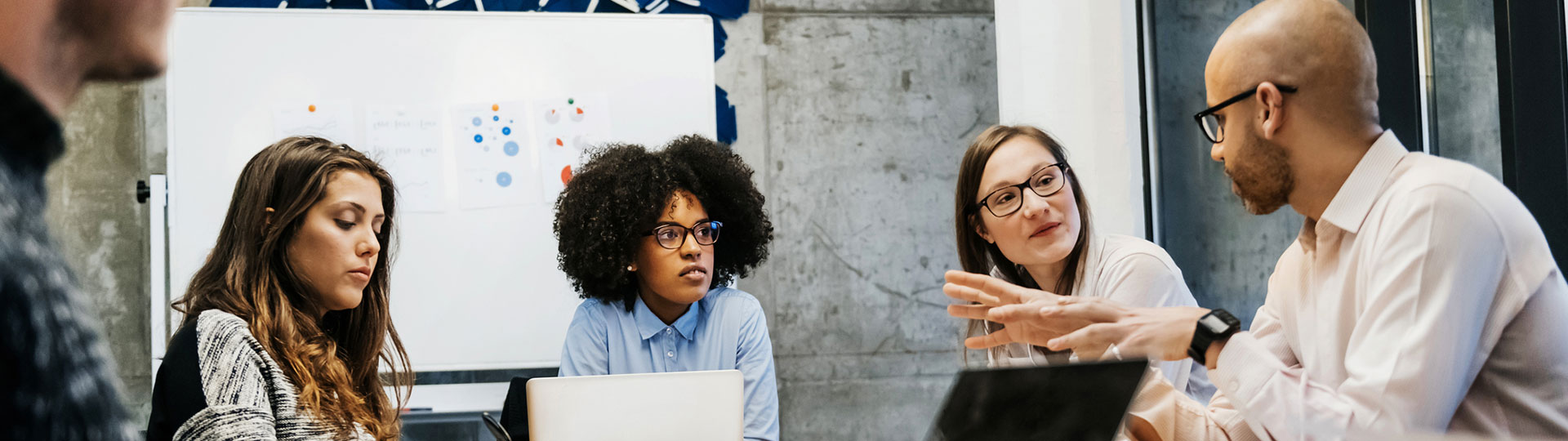 A group of people in a meeting