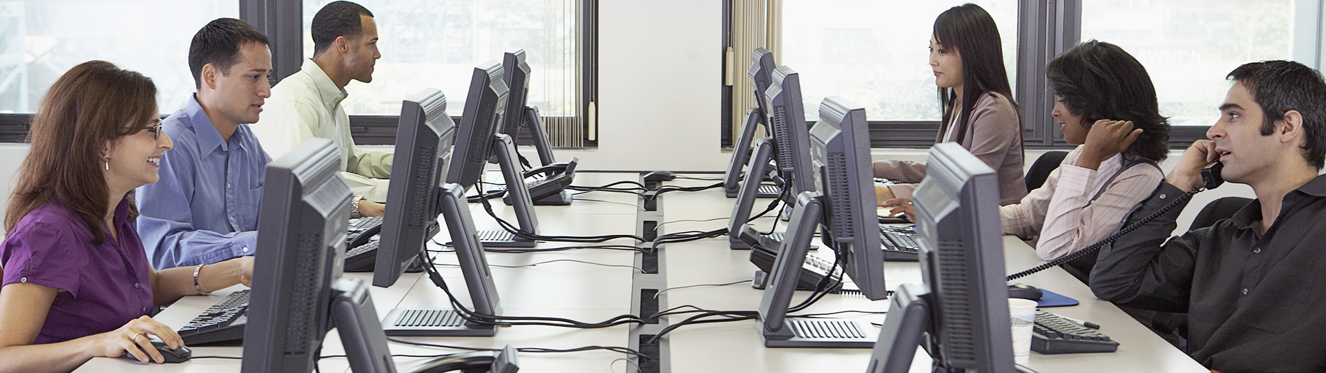 A group of people at computers