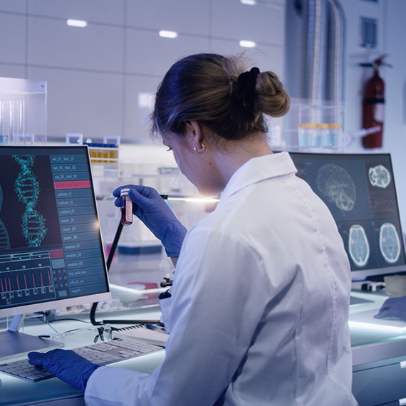 A lab technician studying a sample