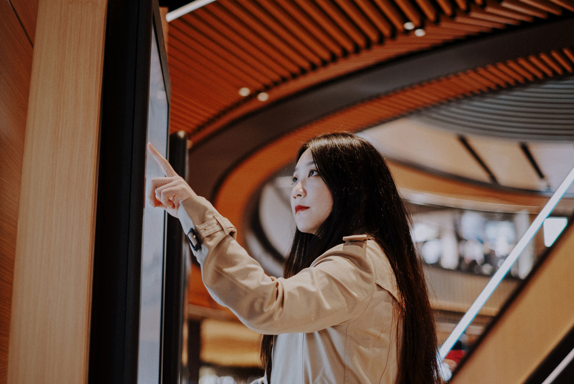 Woman touching a screen