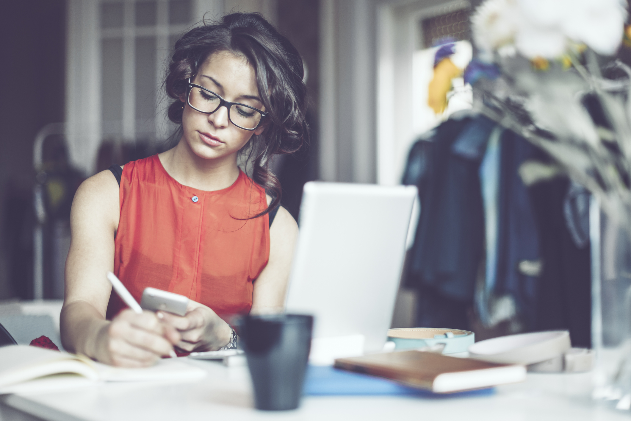 Woman working at a desk in her home