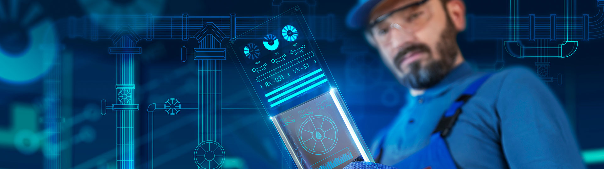 An engineer looking at data on a screen