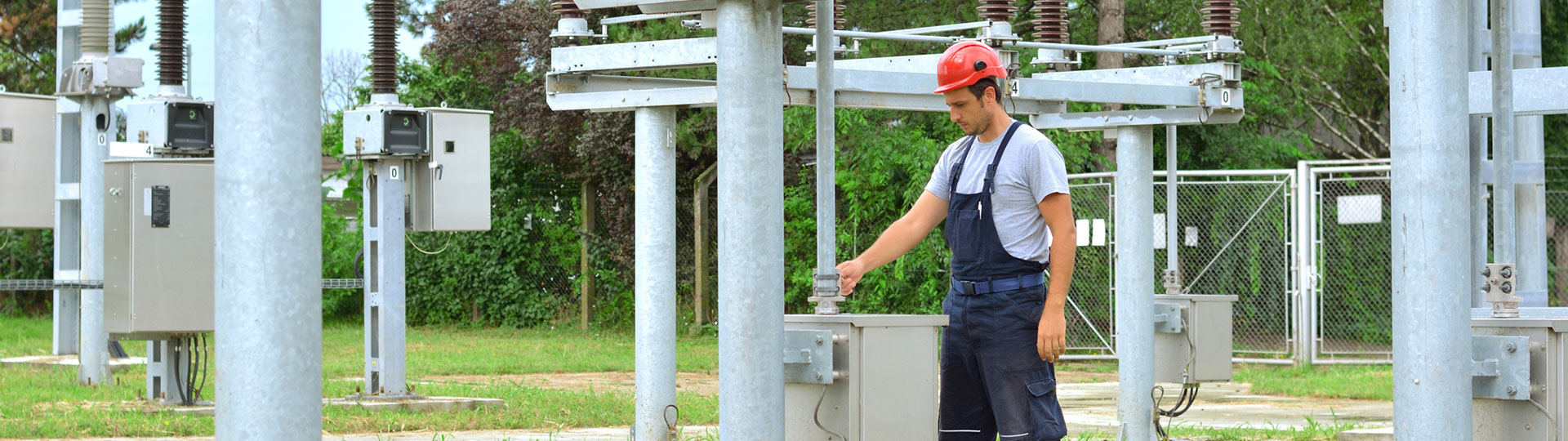 An engineer inspecting equipment in an electrical substation