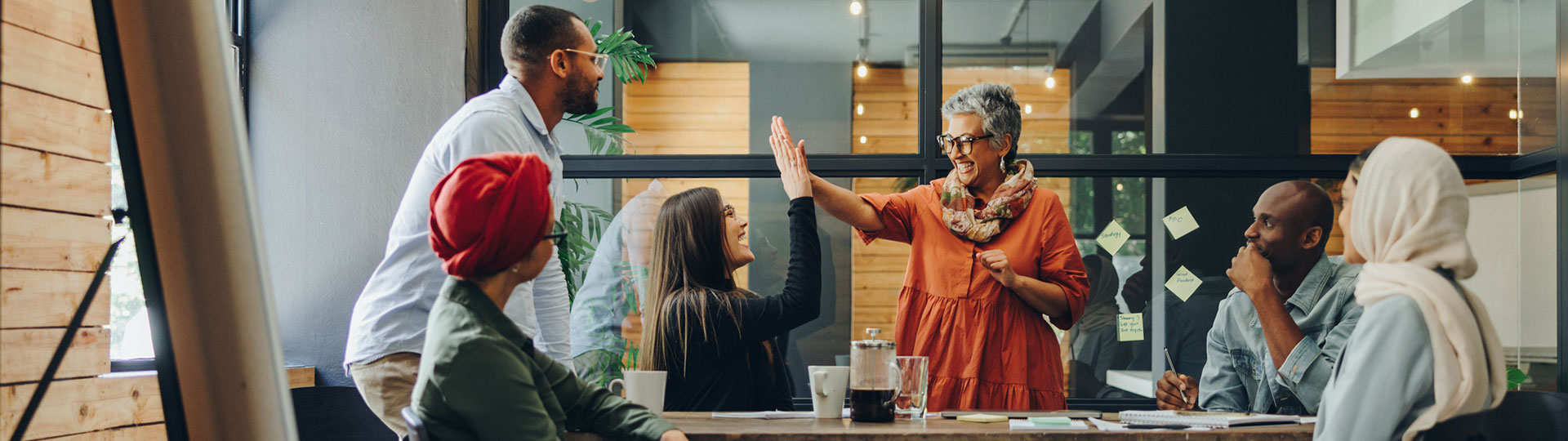 Two colleagues making a 'high five' 