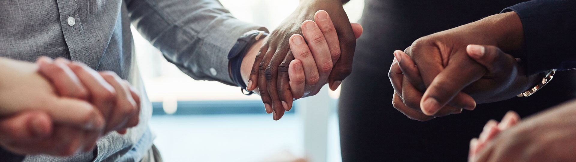 A circle of people holding hands