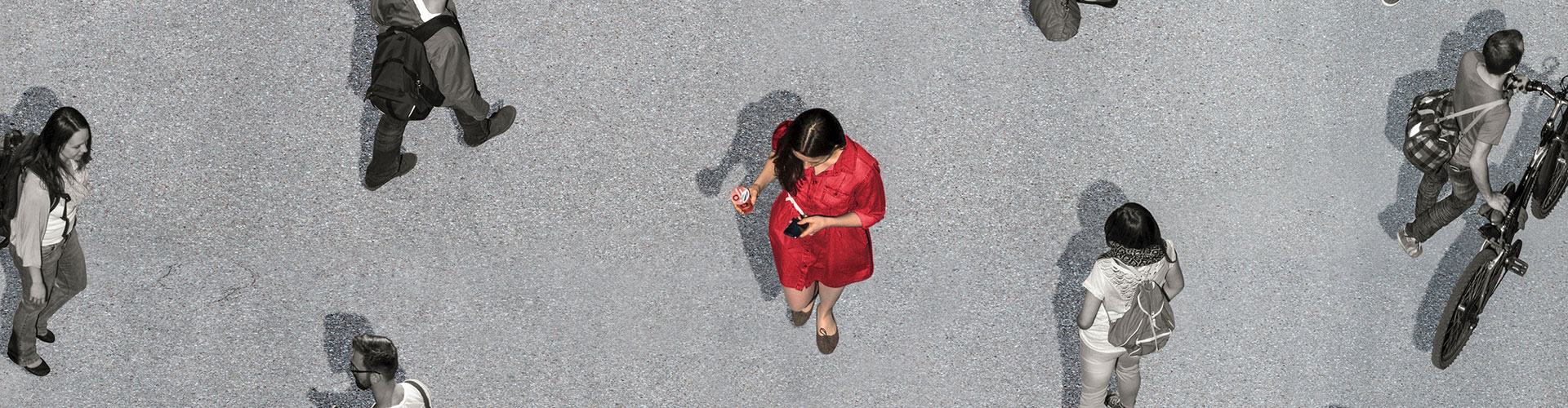 Woman walking among other people