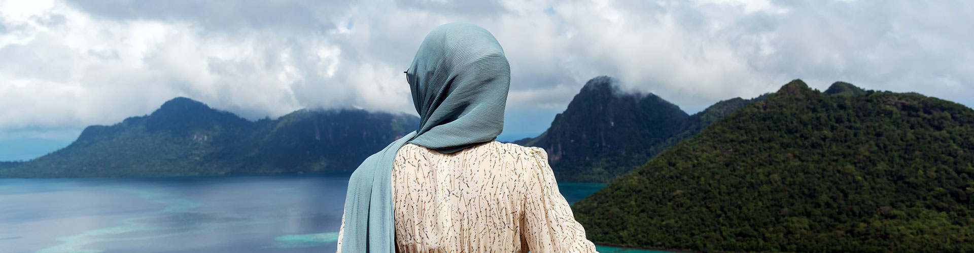 Woman Looking Over Beautiful View of an Ocean in Bohey Dulang