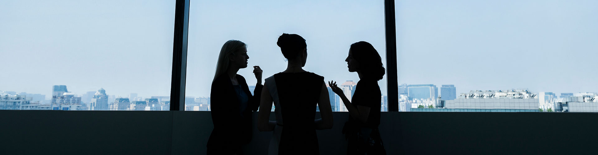 Group of women having a conversation in an office