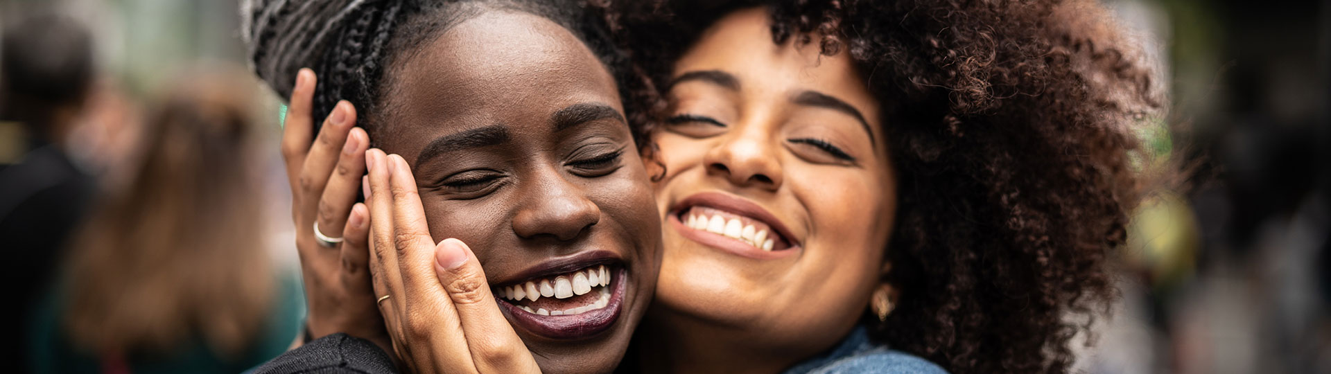 Two girl friends are hugging