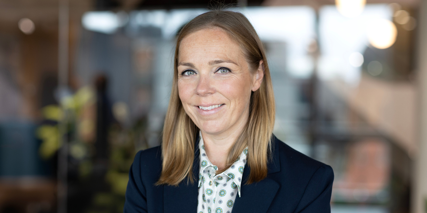 A professional headshot of Amy Taggart