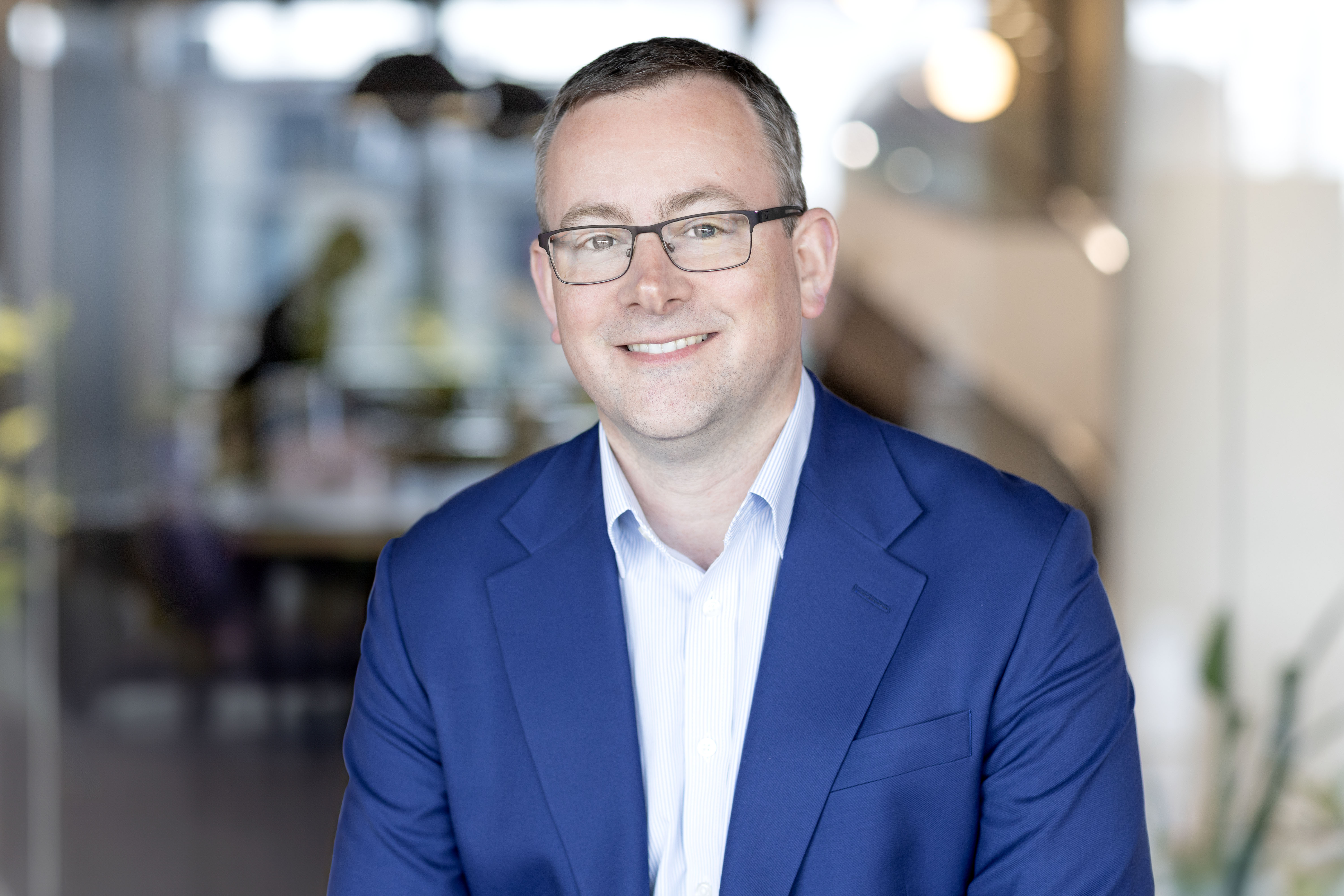 A professional headshot of Jamie Ogilvie‑Smals