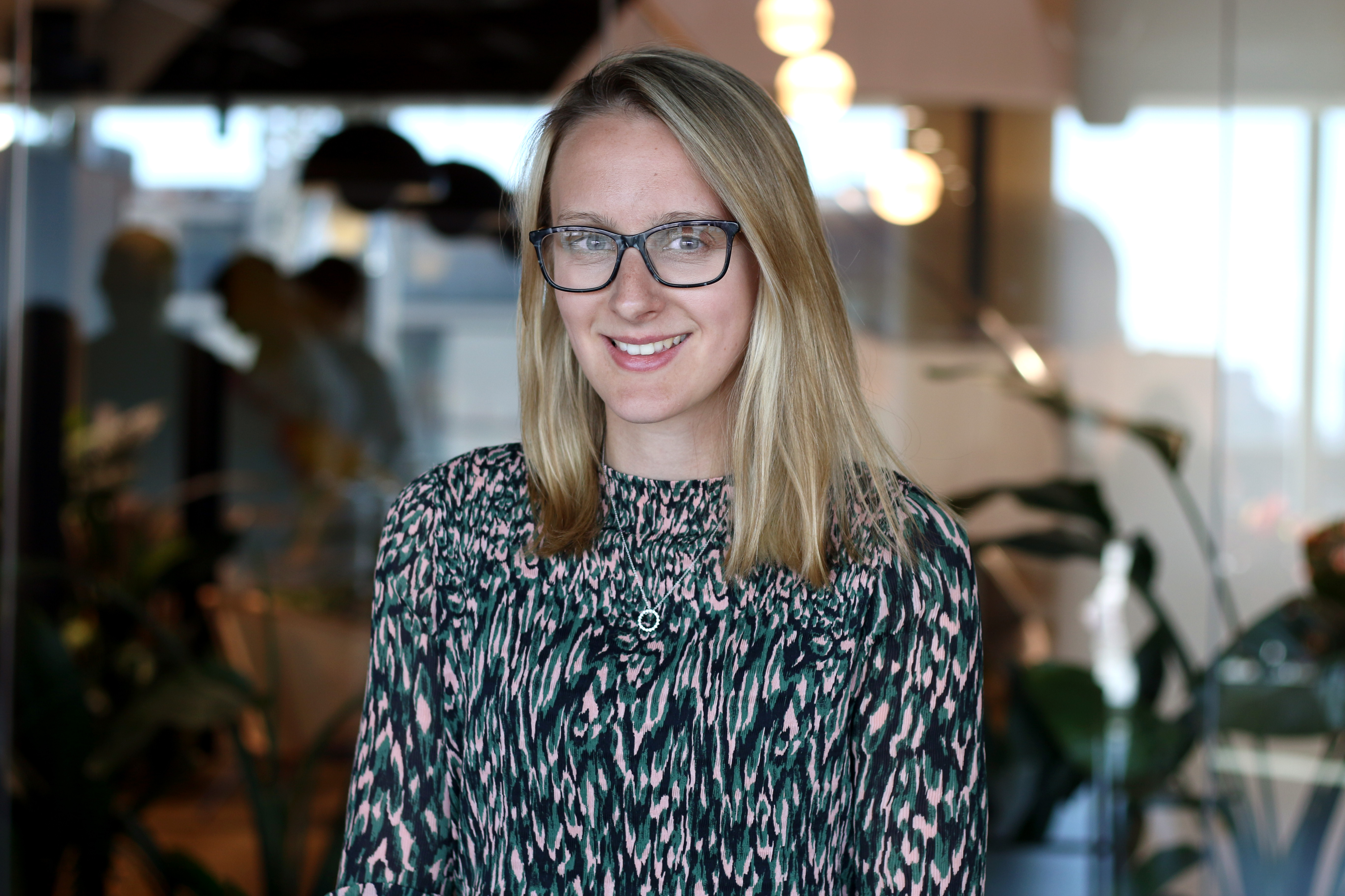 A professional headshot of Katie Davidson