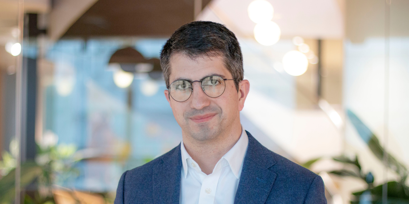 Professional headshot of Paul Thornhill, a Baringa expert, smiling in a suit