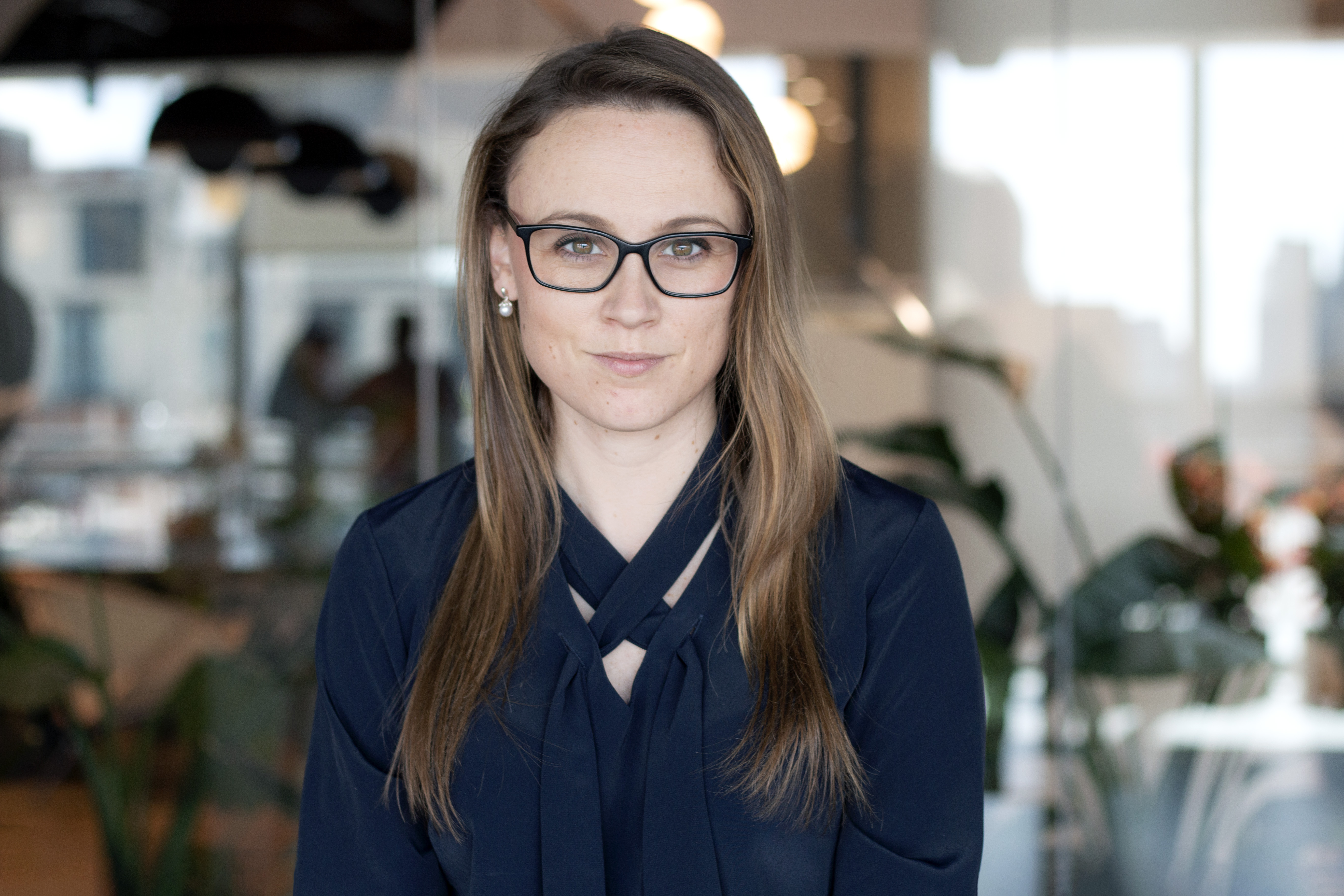 Professional headshot of Kelly Bommers, a Baringa expert, smiling in professional attire