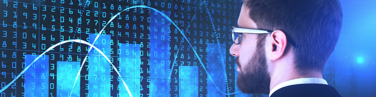 Man looking at charts on a screen