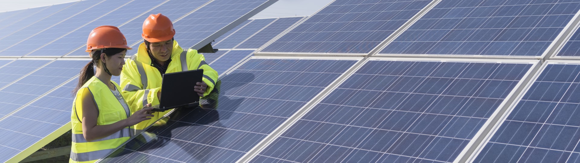 Two engineers working on solar panels
